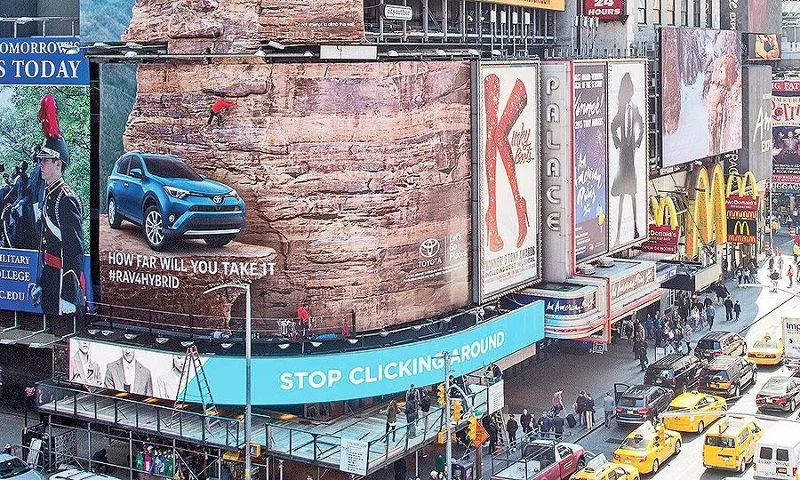 Toyota's interactive billboard featuring a real rock-climbing wall in Times Square.