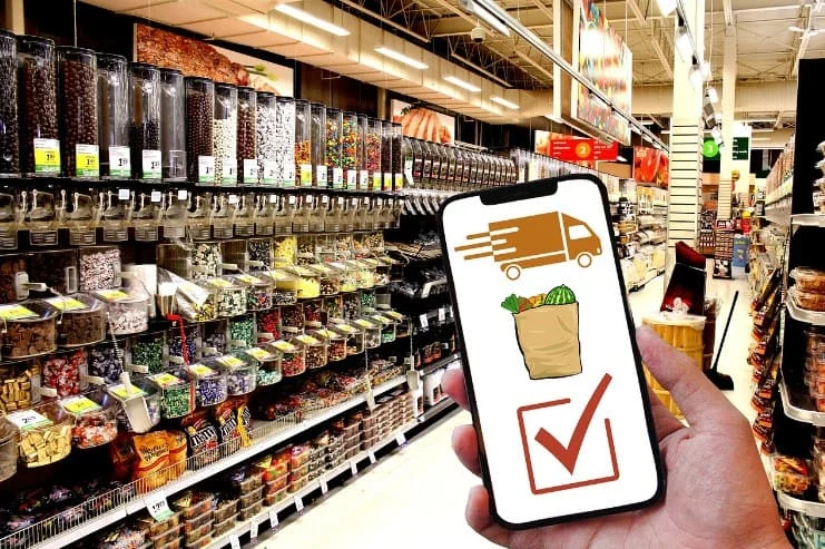 Smartphone with delivery app in a supermarket