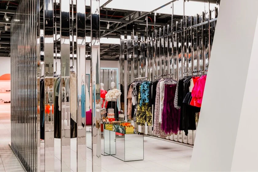 Store with mirrored panels creating an interior room with bright even wear