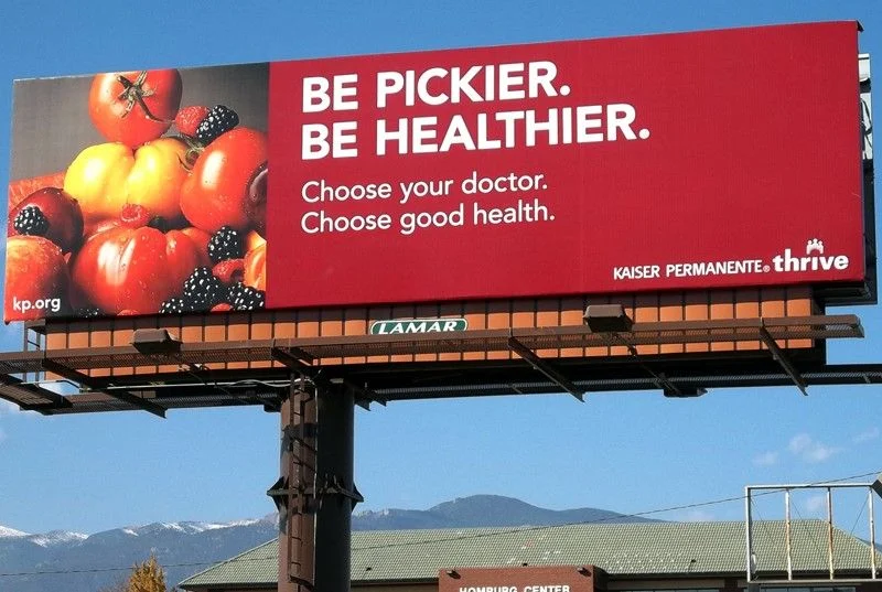 A billboard from Kaiser Permanente with a health advisory.