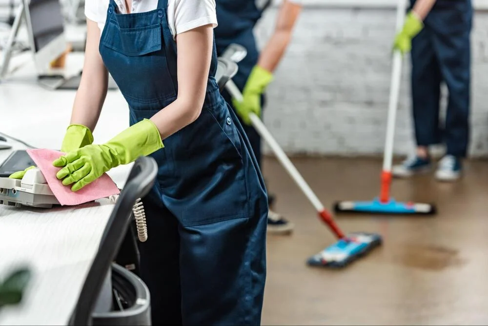 People cleaning an office space
