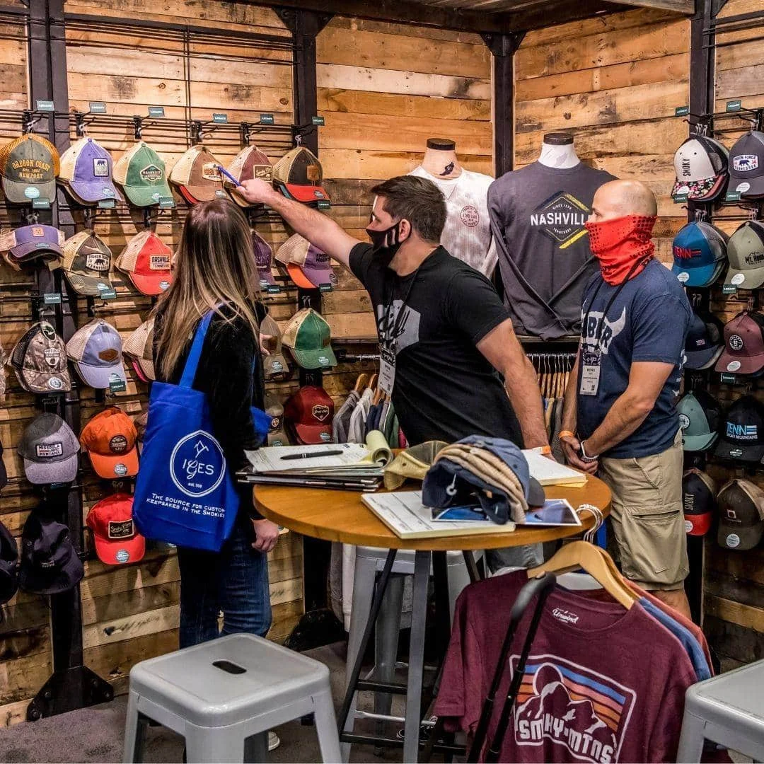 Woman choosing a product from Gift Expo in International Gift Expo in the Smokies.