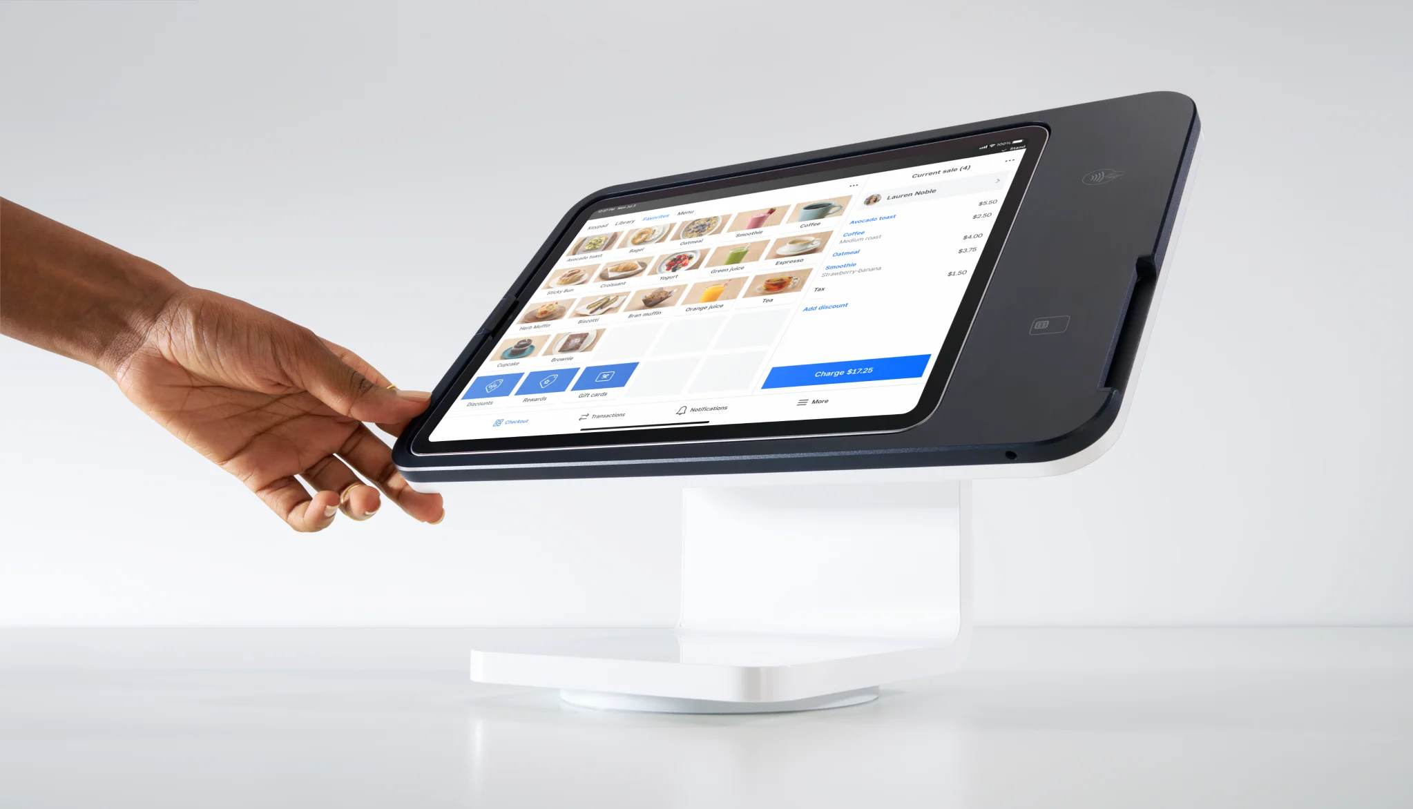 Square Stand holding an iPad at a retail checkout counter.