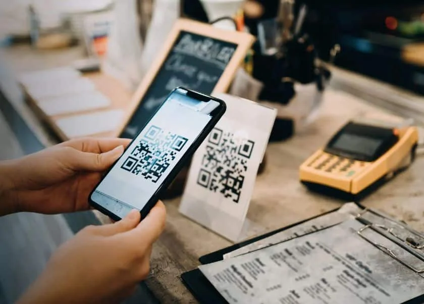Scanning QR code using mobile phone.